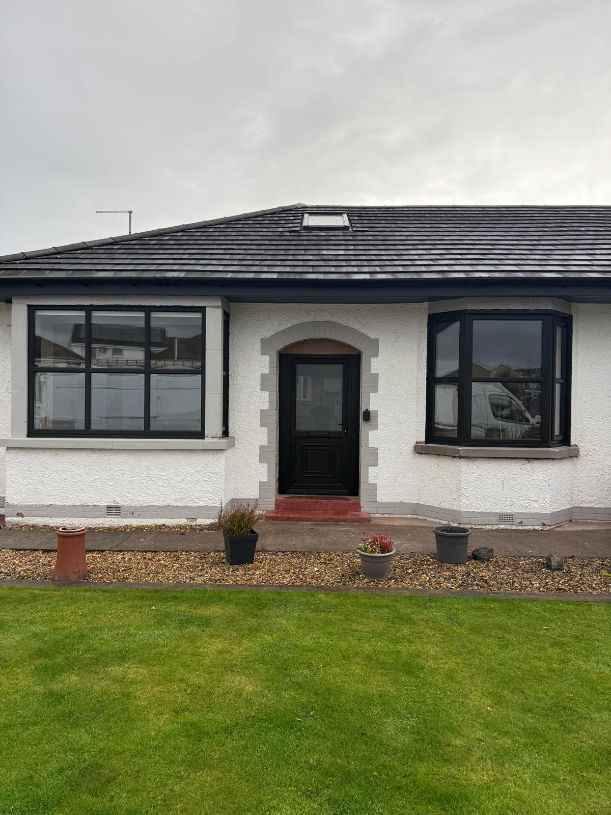 Bungalow with new anthracite bay window and a black front door