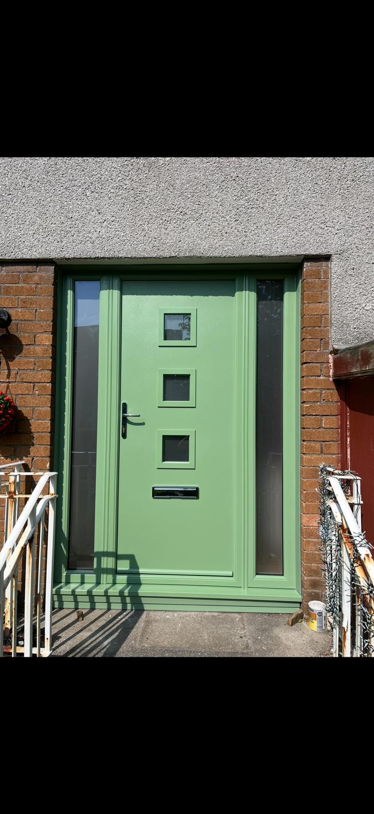 Sage green composite door with a row of small squares and matching sidelight